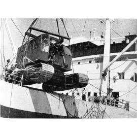 Unloading a mobile crane at Townsville wharf, to be used by the Harbour Board in the reconstruction of the Port, August 1949 