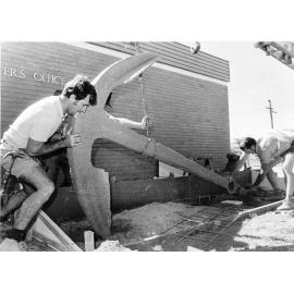 Anchor of the "City of Adelaide" being set in position outside the Harbour Master's office, Townsville, 9 July 1974