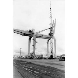 Assembling the last section of the container crane, Townsville harbour, 1974