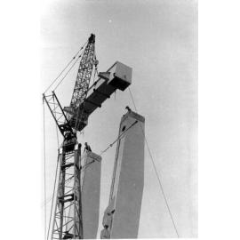 Assembling the last section of the container crane, Townsville harbour, 1974