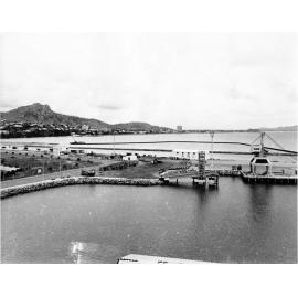 Sheet piling being driven for reclamation of additional areas adjoining the western breakwater, Townsville harbour, 1973 