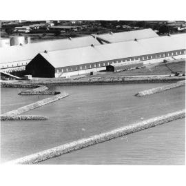 Aerial view of construction of roll on, roll off site, Townsville harbour, South Townsville, Townsville, 17 April 1968