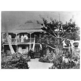 Neils and Sidsel Jensen at the foot of the steps of their farmhouse, c1916. 