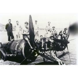 The whole QANTAS engineering staff being photographed on the wing tip of a flying boat in Townsville, 1942