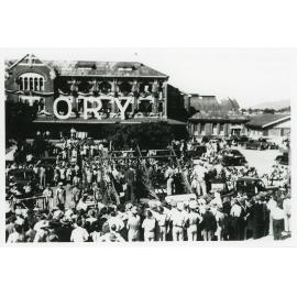 Victory Parade passing by the Railway Station, Flinders Street West, Townsville, 10 June 1946