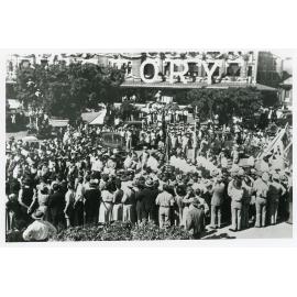 The Victory Parade passing the saluting point in front of the Railway Station, Flinders Street West, Townsville, 10 June 1946