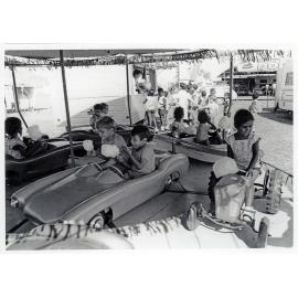 The Lions Merry Muster and children on the Merry Go Round, Townsville, 1 November 1973