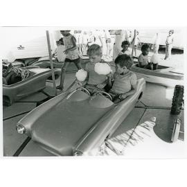 The Lions Merry Muster and children on the Merry Go Round, Townsville, 1 November 1973