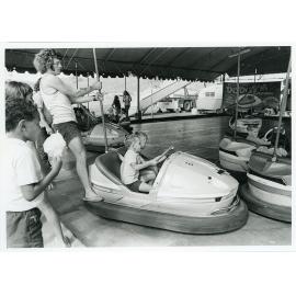 The Lions Merry Muster and children on the Dodgem Cars, Townsville, 1 November 1973