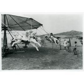 The Lions Merry Muster and children on the Merry Go Round, Townsville, 1 November 1973