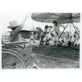 The Lions Merry Muster and children on the Merry Go Round, Townsville, 1 November 1973