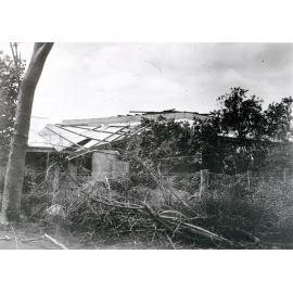 A house damaged by Cyclone Leonta, Townsville, 1903