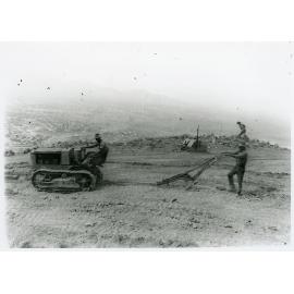 Council tractor and plough during construction of Hynes Highway on Castle Hill, Townsville, 1936