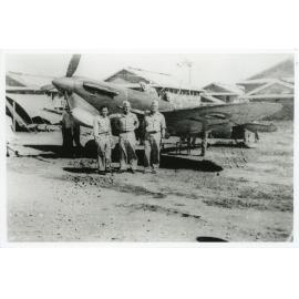 Kittyhawk aircraft and servicemen at the R.A.A.F. base, Garbutt, Townsville, 1942
