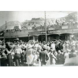 Spectators gathered for the Victory Parade, Flinders Street West, Townsville, 10 June 1946