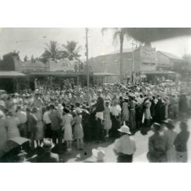 Spectators gathered for the Victory Parade, opposite the Railway Station, Flinders Street West, Townsville, 10 June 1946