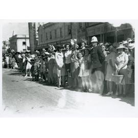 Spectators gathered for the Victory Parade, Flinders Street, Townsville, 10 June 1946