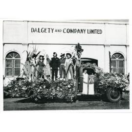 Participants on the Dalgety and Co. float in the Victory Parade, Townsville, 10 June 1946