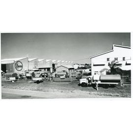 Crane and shipping containers at the Townsville harbour, South Townsville, Townsville, 1970