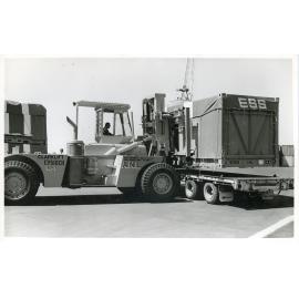 Forklift at the Townsville harbour, South Townsville, Townsville, 1975