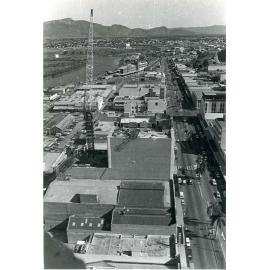 Aerial view of Flinders Street, showing the Commonwealth Bank under construction, Townsville, 1977
