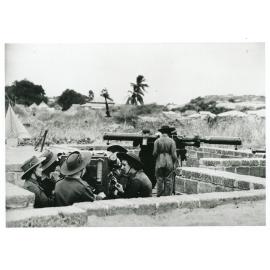 Members of the [Australian Women's Army Service] at the gun emplacement on the Strand, Townsville, 1943