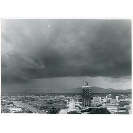 Storm clouds gathering over Townsville city, 21 December 1984