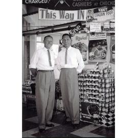 Philip Leong and Kraft representative, Mr. McColl, at a sales promotion at Philip Leong's Hermit Park store, Townsville, 1950s