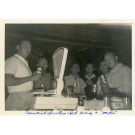 Philip Leong at "smoko" with the Commercial Travellers, Hermit Park store, Townsville, [1960]