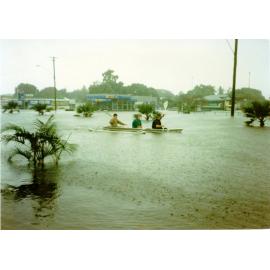 Rowing down Charters Towers Road, Hermit Park, Townsville, January 1998. 