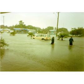 Toyota Landcruiser travelling along a flooded Charters Towers Road, Hermit Park, Townsville, January 1998. 