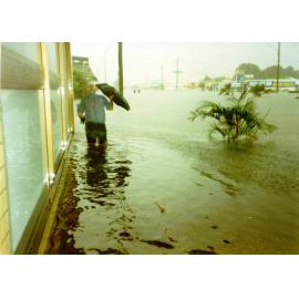 Walking down a flooded Charters Towers Road, Hermit Park, Townsville, January 1998
