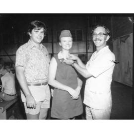 President of the National Fitness Council, Alderman O.K. (Kel) [Griffiths] presents Duke of Edinburgh silver awards to Gudrun Steinhofer and Paul Rogers, 1973
