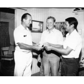 Dr. Norman Scott-Young, MLA, presents cheques to J. West of the Marlins Amateur Swimming Club and to Dick Goon Chew, President, Townsville Recreation Club, Townsville, 2 May 1974