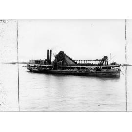 Bucket dredge "Octopus" in operation in the harbour, Townsville, ca.1900 