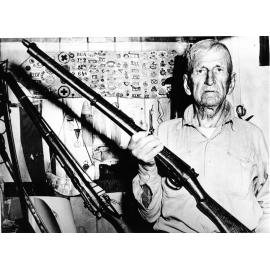 Saint John Robinson, Boer War veteran with the 303 Long Lee Metford Rifle he carried thoughout the campaign, ca. 1965. 