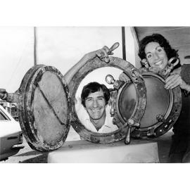 Doug Tarca and Dorothy Unsworth with a porthole from the Yongala. 