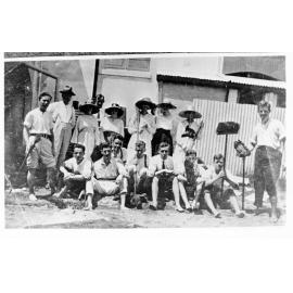 Commonwealth Bank staff cleaning up after a flood, Townsville. 