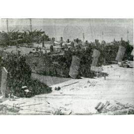 Four U.S. LST's discharging equipment on the Strand beach near Kissing Point, Townsville, 1942