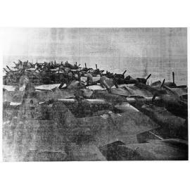 U.S. escort carrier loaded with BATT fighter planes entering Townsville harbour, 1942