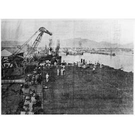 BATT fighter plane being unloaded from a U.S. escort carrier at Townsville, 1942