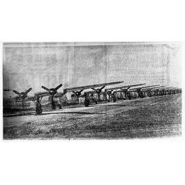 Liberator (B-24) fighter planes lined up on the tarmac, Garbutt airfield, Townsville, 1942