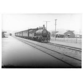Steam train opposite Byers store, Railway Avenue, Railway Estate, November 1946. 