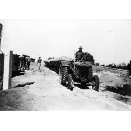Sand being removed from the Strand to fill the salt pans bordering Jacob's Creek 