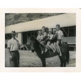 Mr. Anderson, a neighbour who owned a horse with the children of the Stuart Immigration Holding Centre, Townsville, ca.1952