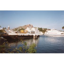 The bookmobile of the Townsville Public Library Service on the Magnetic Marine barge "Mareeba", Townsville, [1990s]
