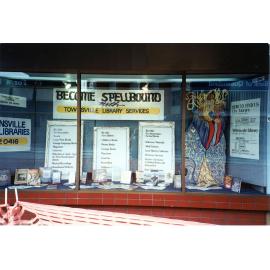 Townsville Public Library display in NORQEB building window, Stokes Street, Townsville, ca 1990