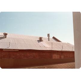 Roof and brick wall of Arcade, Town Hall, Flinders Street, Townsville, 1978