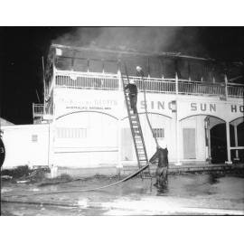 Firemen attending the Rising Sun Hotel fire, Townsville. 