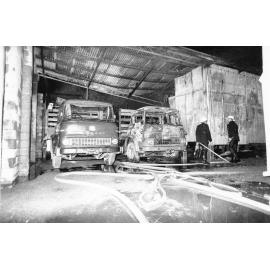 Fire damage to the warehouse and trucks of L.J. West and Sons, South Townsville, Townsville